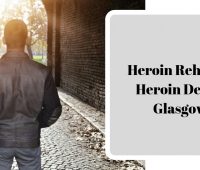 Man walking through brick archway towards sunlit park, with text overlay 'Heroin Rehab & Heroin Detox Glasgow'