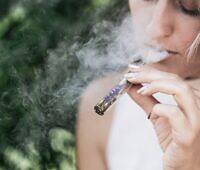 Woman smoking cocaine, illustrating the harmful effects and risks of cocaine abuse