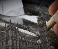 Hand holding cocaine line next to miniature Big Ben and Houses of Parliament, symbolizing drug issues in London