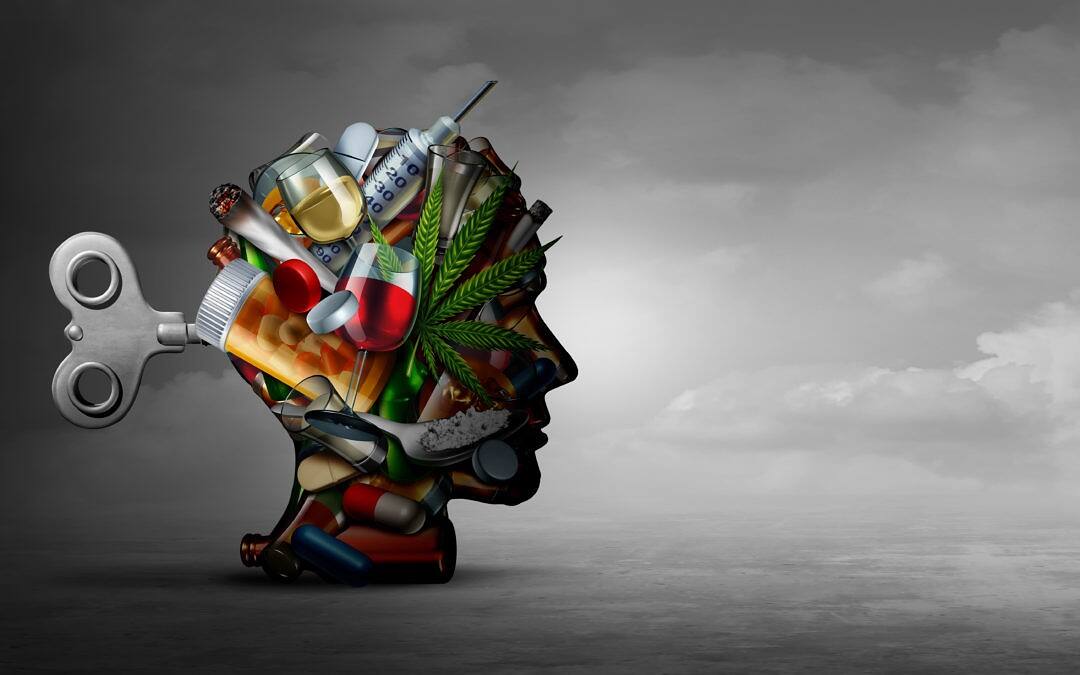 Silhouette of a human head filled with various drugs, alcohol, and paraphernalia, with a wind-up key in the back, symbolizing addiction's control over the mind