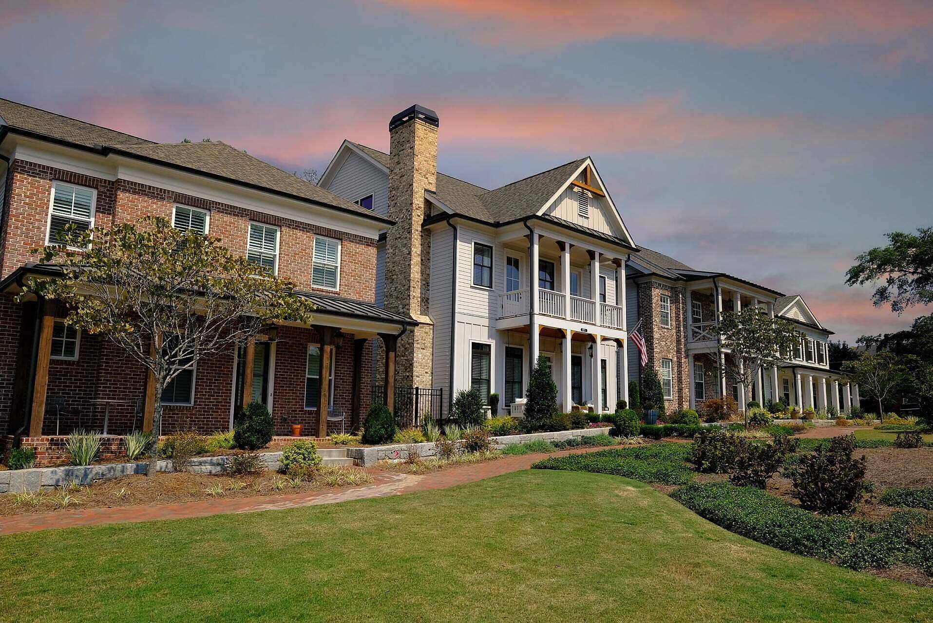 A picturesque rehabilitation center featuring multiple residential buildings surrounded by manicured lawns and gardens, representing a peaceful environment for alcohol rehab in Leicestershire.