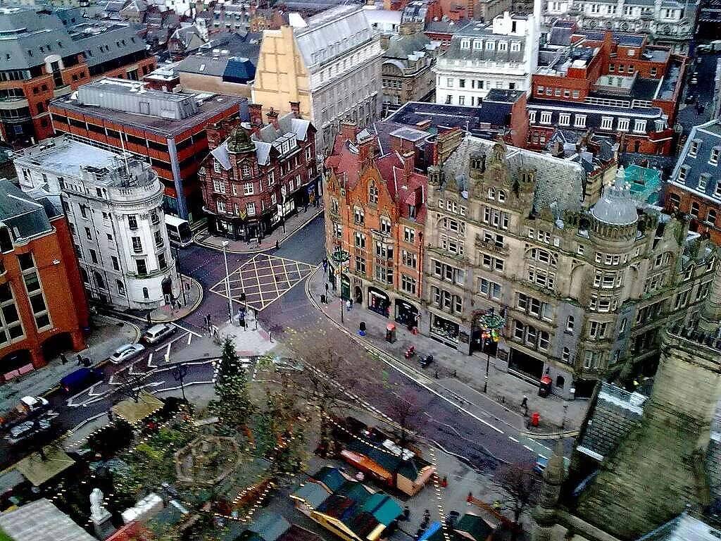 Aerial view of Manchester city centre, showcasing historic architecture and bustling streets near rehab facilities