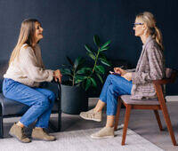 Two women in a counseling session at an alcohol rehab center in Berkshire.