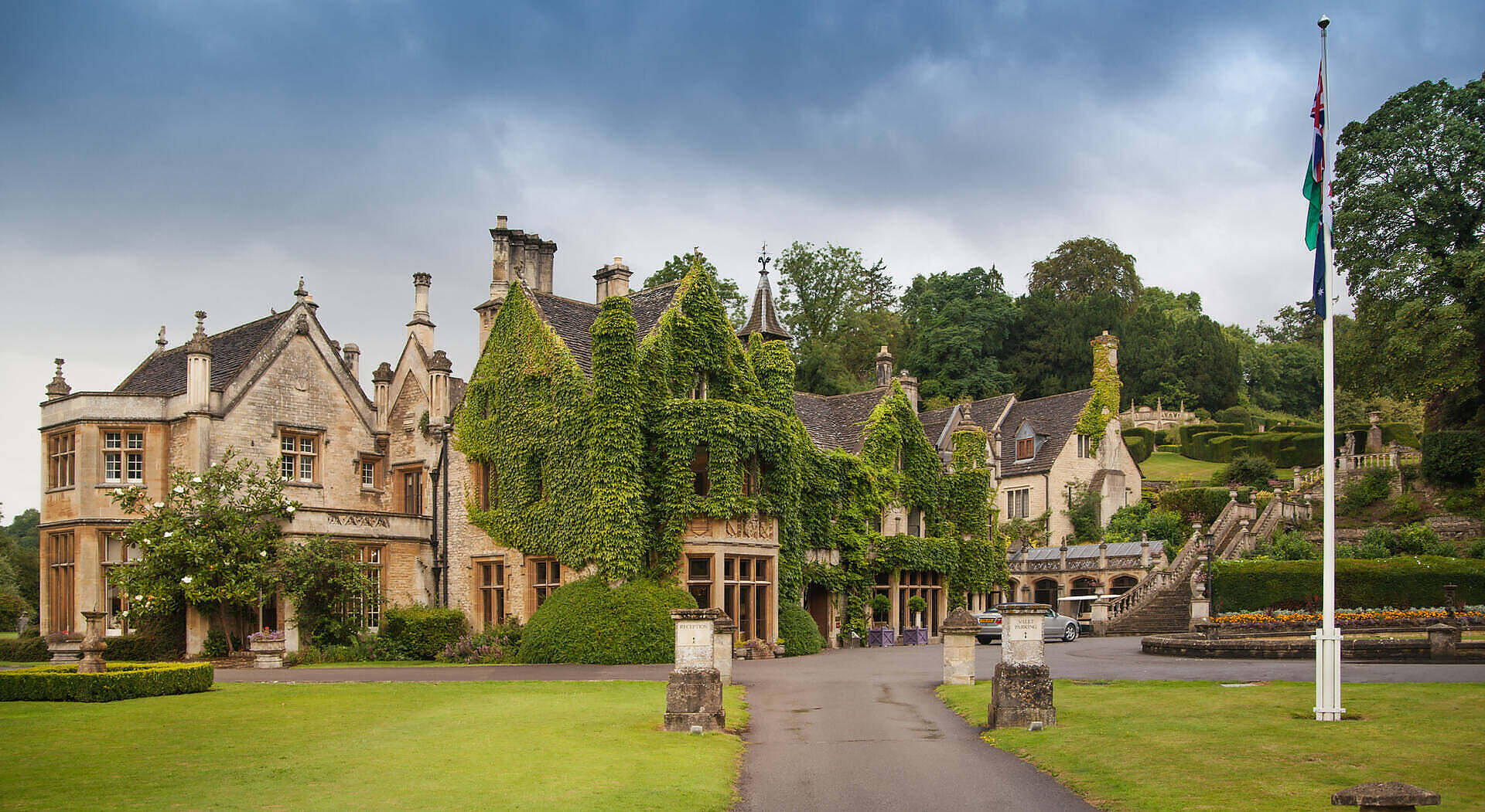 Elegant stone manor house with ivy-covered walls, serving as an alcohol rehab facility in Nottinghamshire, surrounded by manicured lawns and gardens