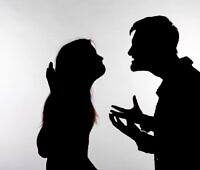 Silhouette of two people in confrontation, depicting Signs of Cocaine Addiction and the issues it can place on relationships and communication