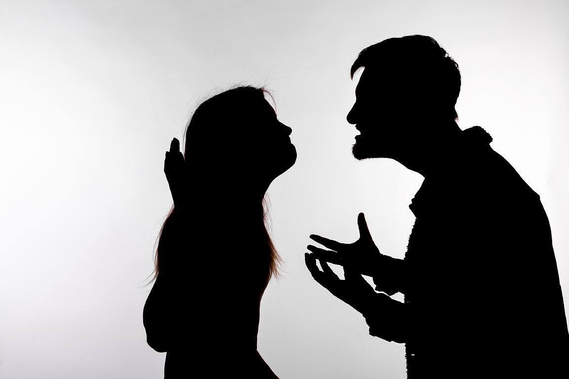 Silhouette of two people in confrontation, depicting Signs of Cocaine Addiction and the issues it can place on relationships and communication