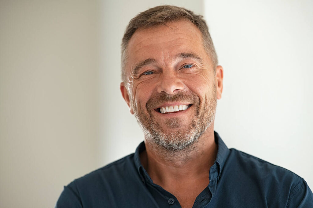 addiction recovery success happy health man portrait John