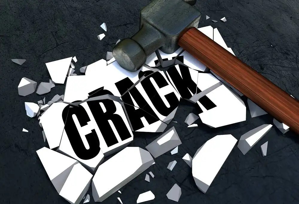 3D illustration of a hammer shattering the word "CRACK" on a dark background, symbolizing the process of overcoming crack cocaine addiction|Close-up of crack cocaine rocks and drug paraphernalia on a dark surface, illustrating the dangers of crack cocaine addiction and the need for rehabilitation