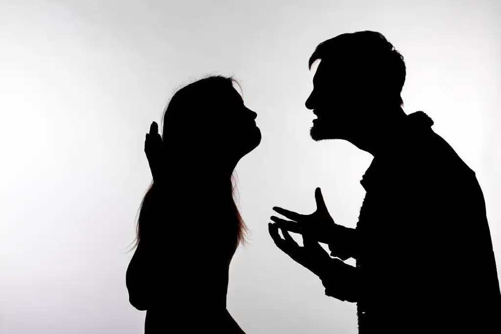 Silhouette of two people in confrontation, depicting Signs of Cocaine Addiction and the issues it can place on relationships and communication